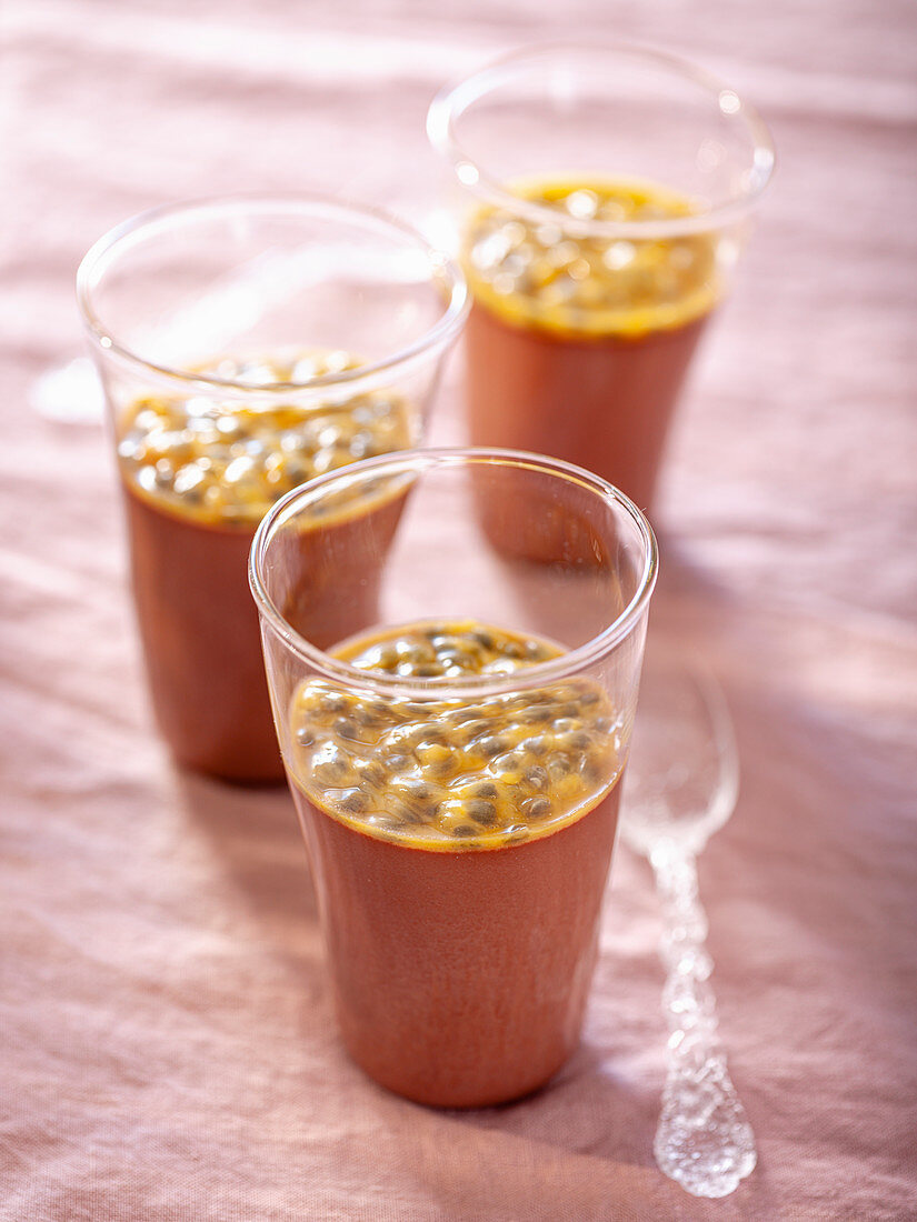 Chocolate panna cotta with passion fruit in glasses