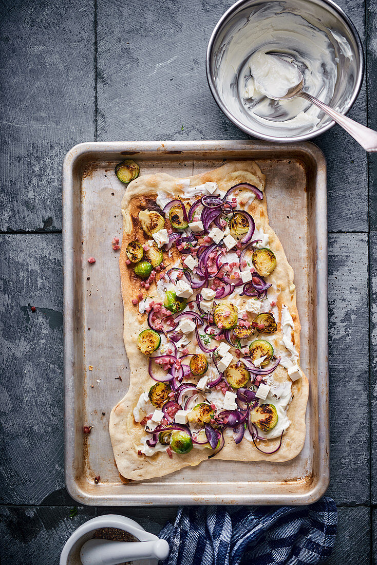 Tarte flambée with red onions and Brussels sprouts