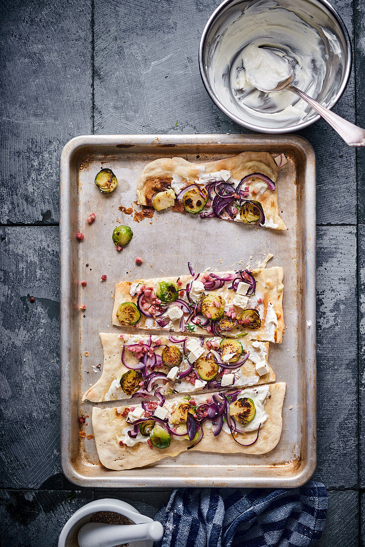 Tarte flambée with red onions and Brussels sprouts