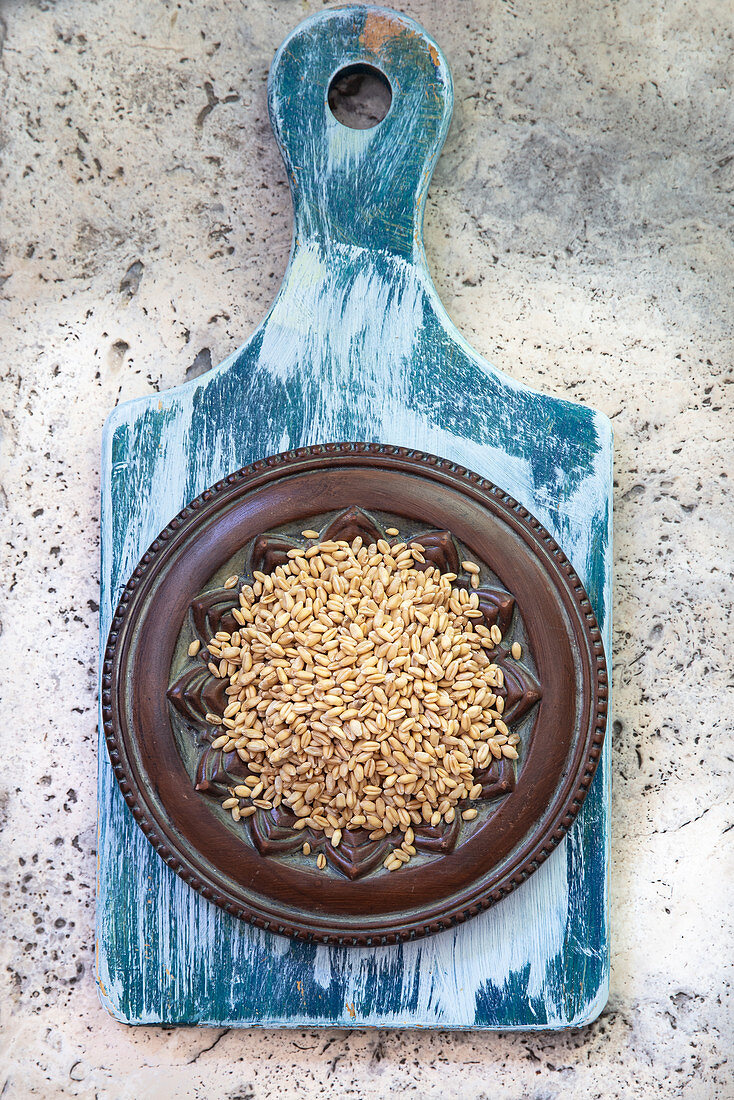 Soft wheat in baking tin on cutting board