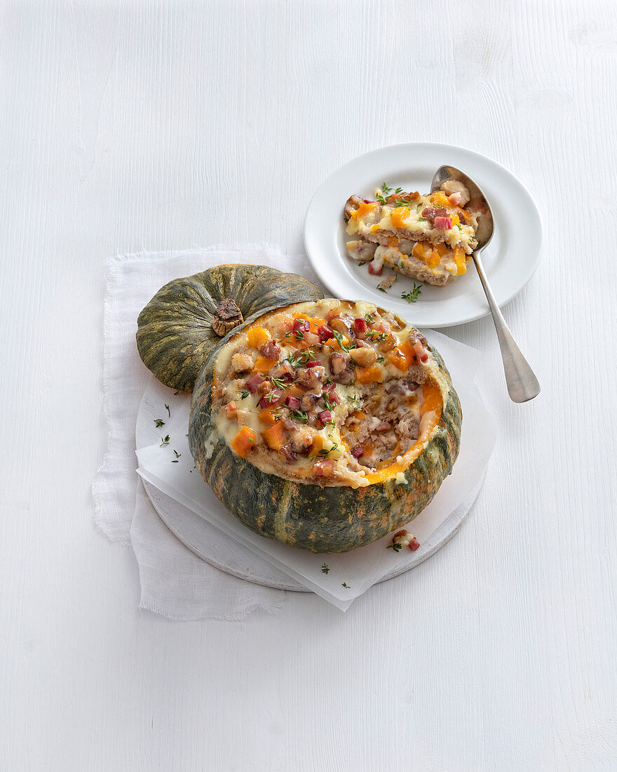 Stuffed pumpkin with chestnuts, ham and croutons