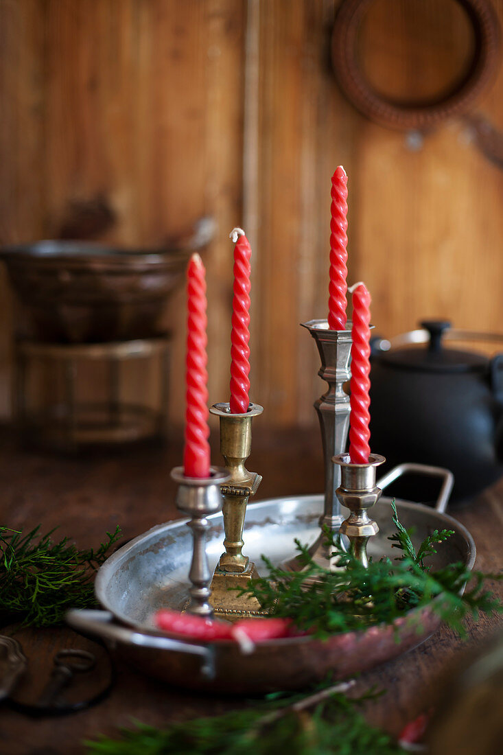 Antique candle holders with red candles