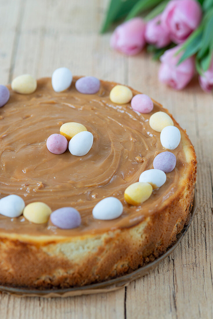 Cheescake decorated with chocolate eggs for easter