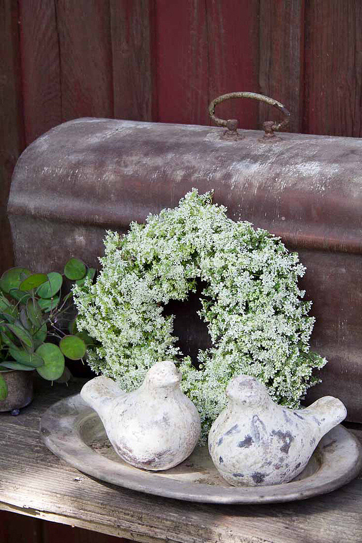 White summer wreath with pottery birds