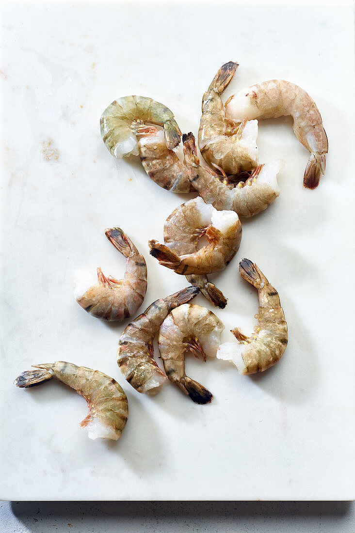 Raw tiger prawns on a marble board