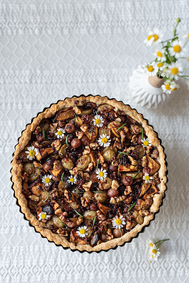 Tart with various berries and nuts