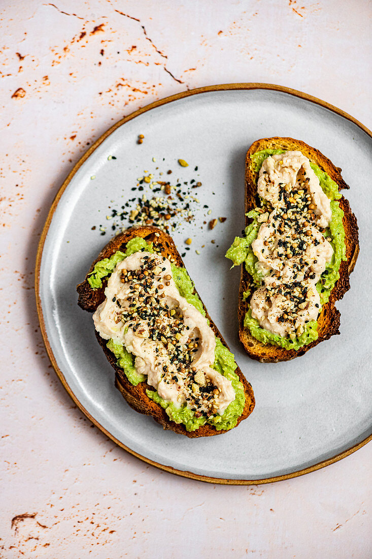 Mashed Avocado on Toast with Roasted Garlic and White Bean Hummus