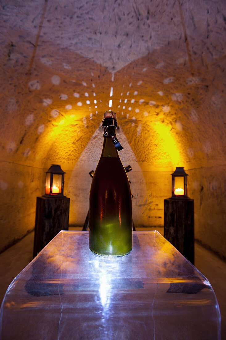 Champagne bottle in a chalk cellar, Champagne Ruinart, France