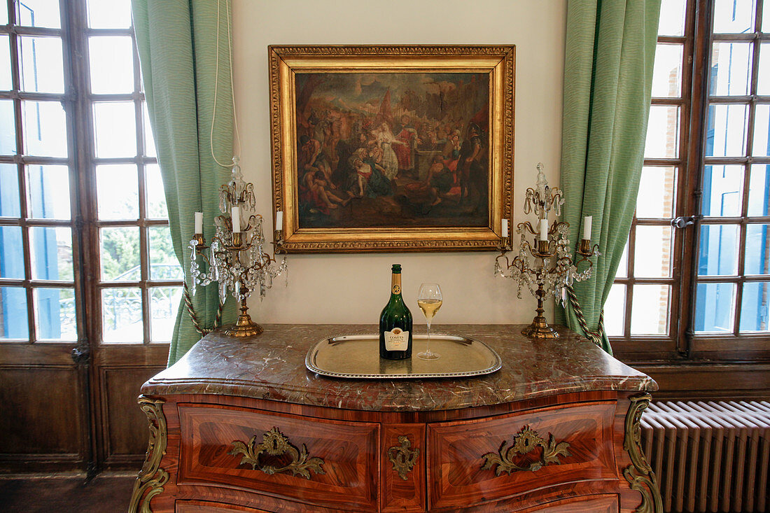 A bottle on a silver tray in a salon, Taittinger, Champagne, France