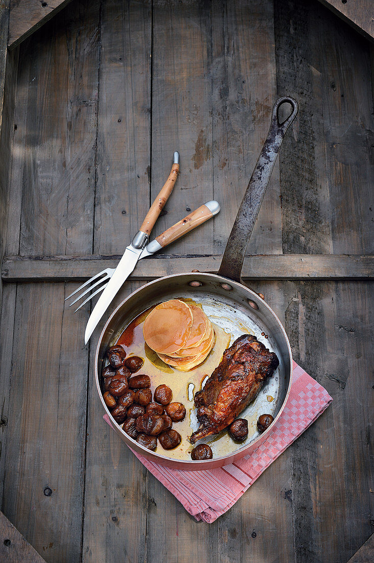 Leg of beaver with caramelised chestnuts, pancakes and maple syrup