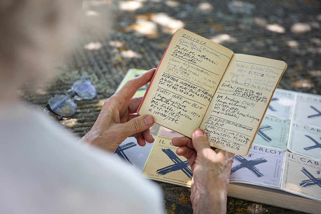 A person holding a notebook, Caberlot, Carnasciale, Tuscany, Italy