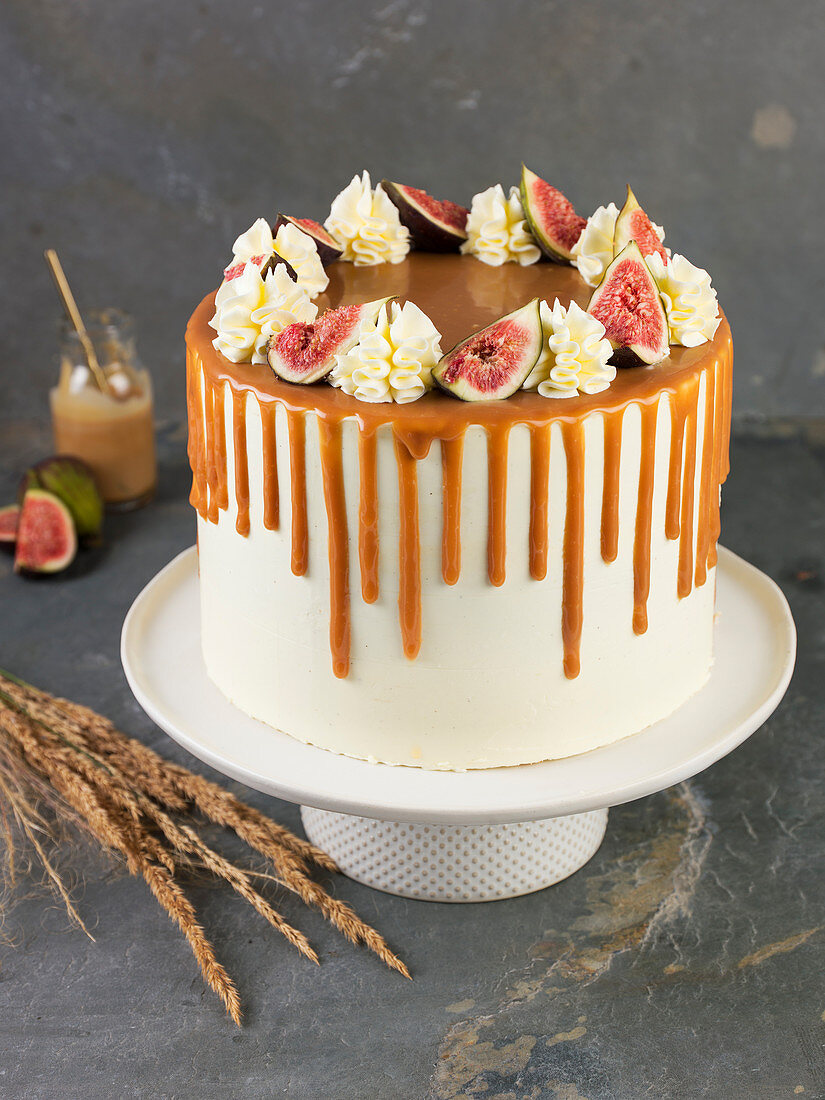 Apple and fig cake on a cake stand
