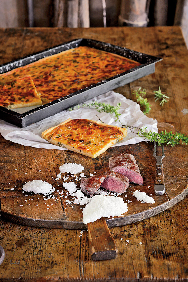 Saddle of chamois in a salt crust with spring onion tart