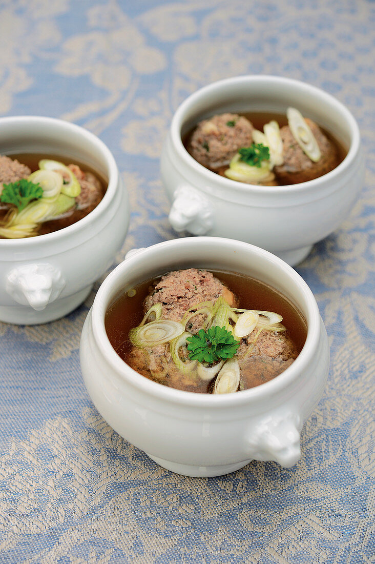 Venison liver dumpling soup in soup tureens