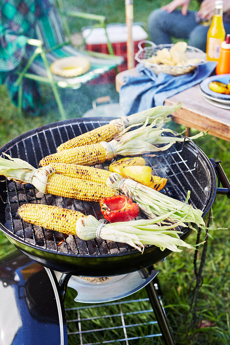 Barbecued corn toppers on grill