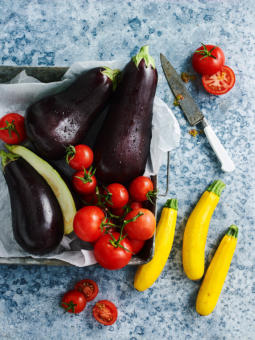 Eggplants, tomatoes and yellow zucchinis