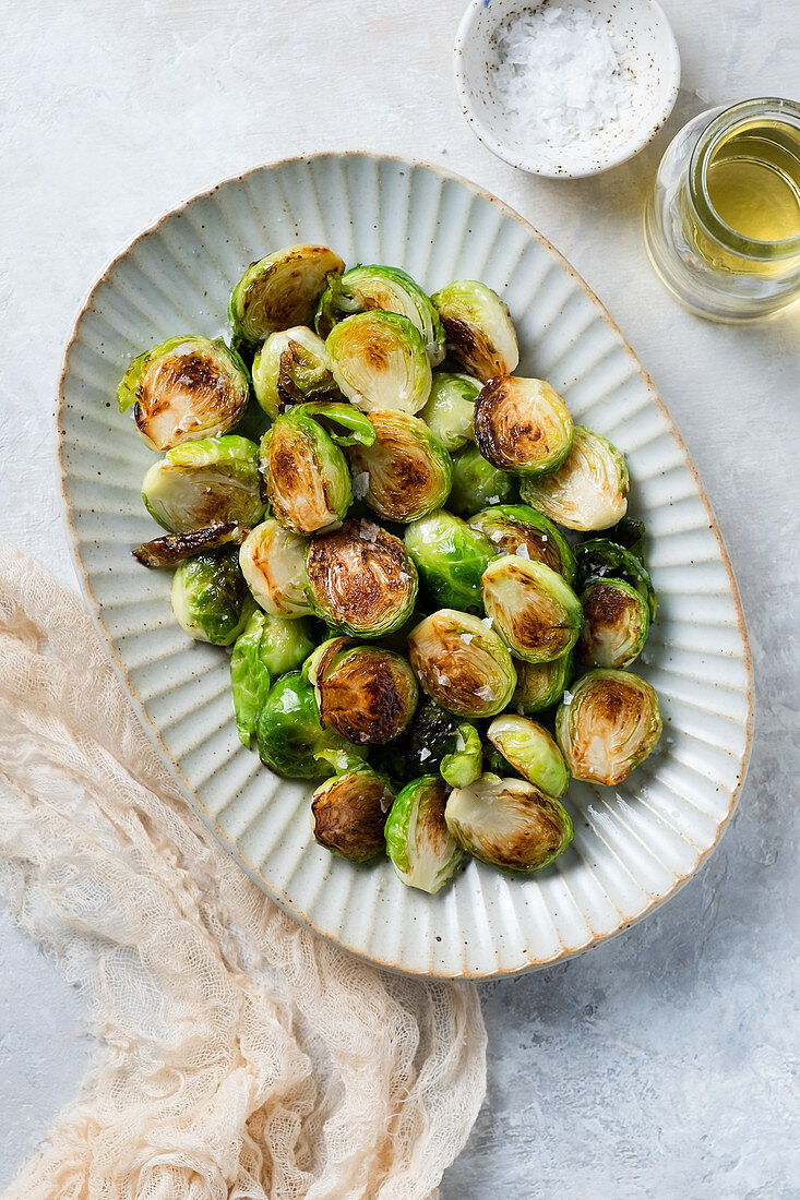 Roasted Brussels sprouts on white plate