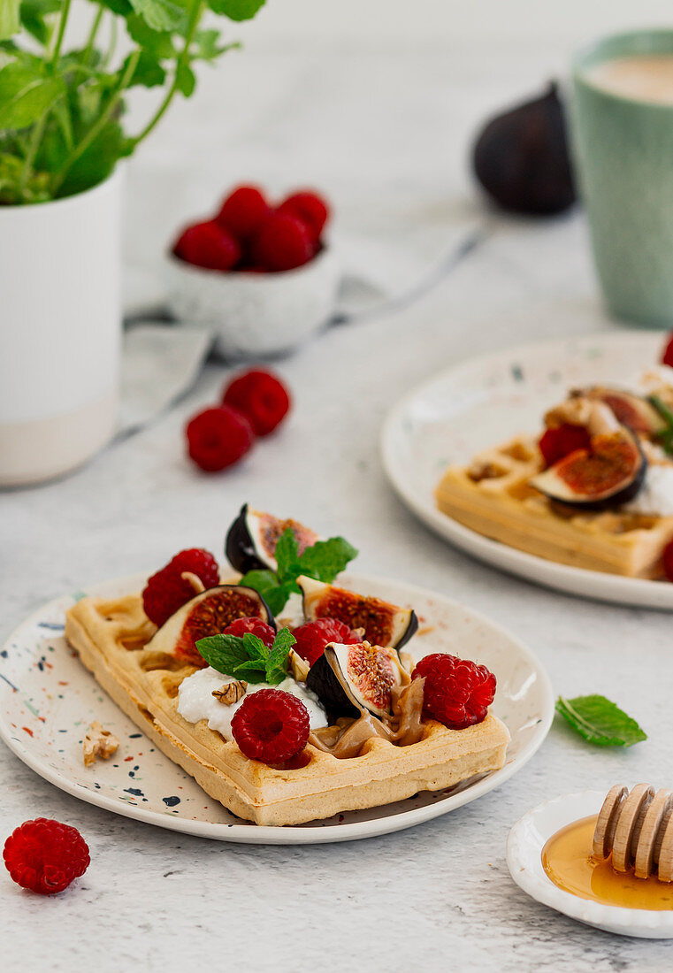 Honey waffles with raspberries, figs and cream