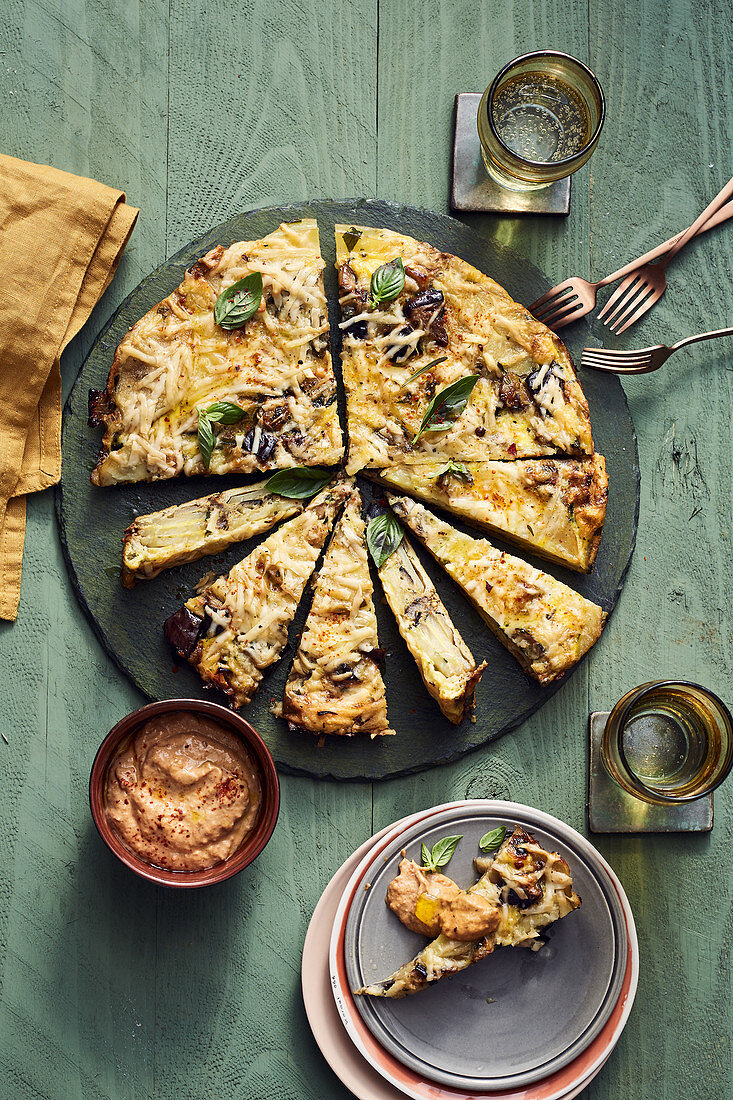 A potato tortilla with aubergines and an olive and tomato mayonnaise