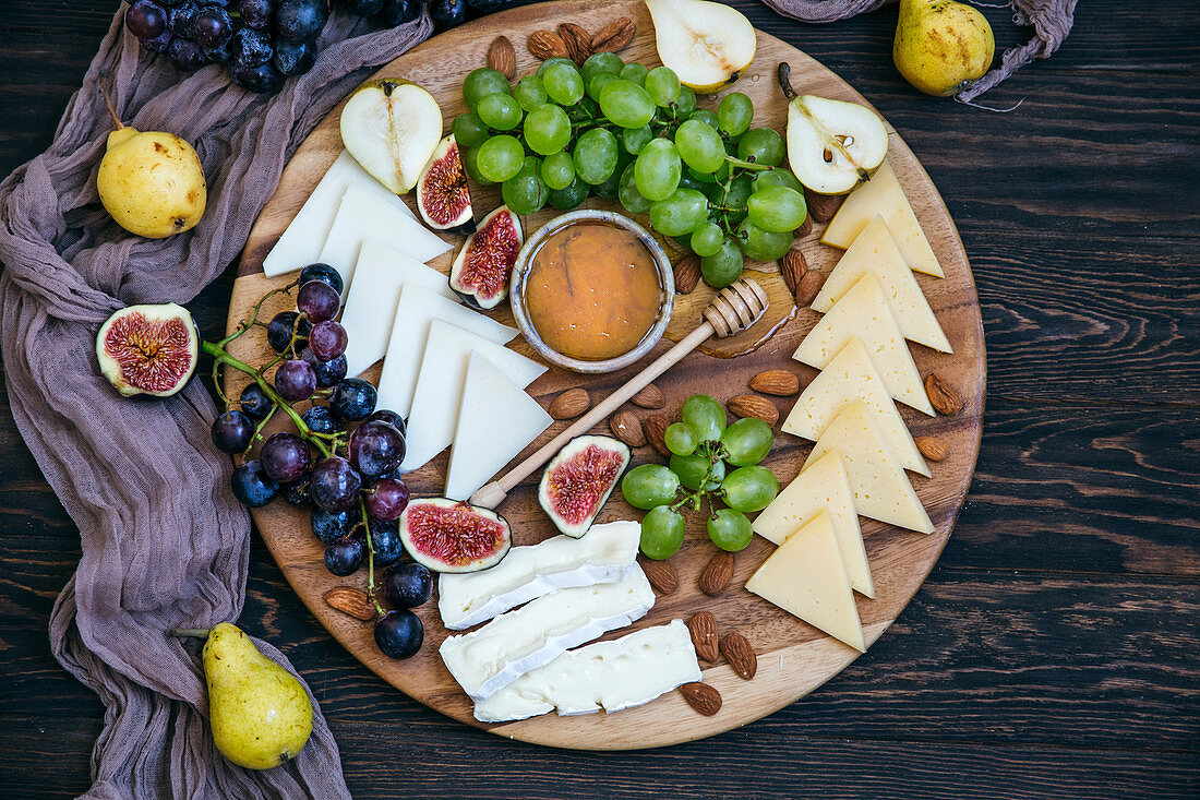 Cheese platter with grapes and figs