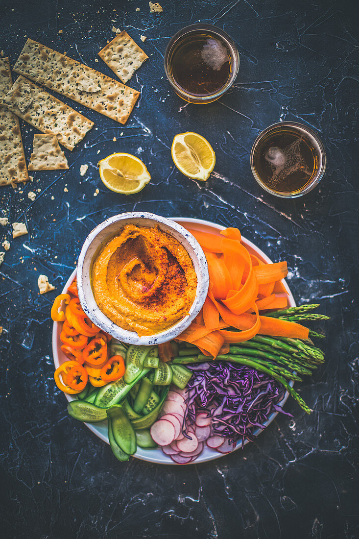 Grilled red pepper hummus served with vegetables