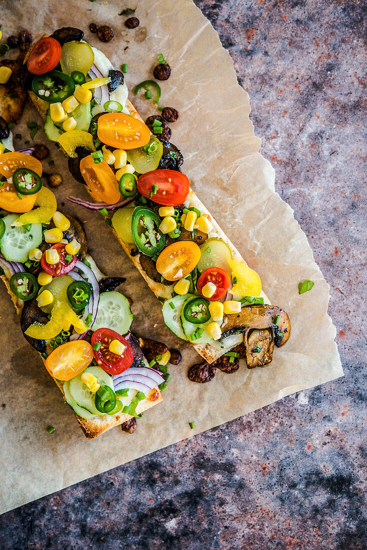 Baked baguettes with mushrooms and vegetables