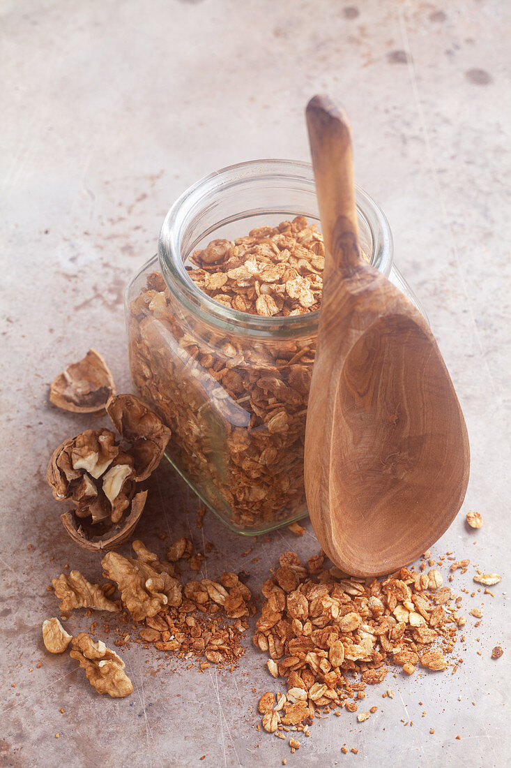 A jar of homemade roasted muesli with walnuts