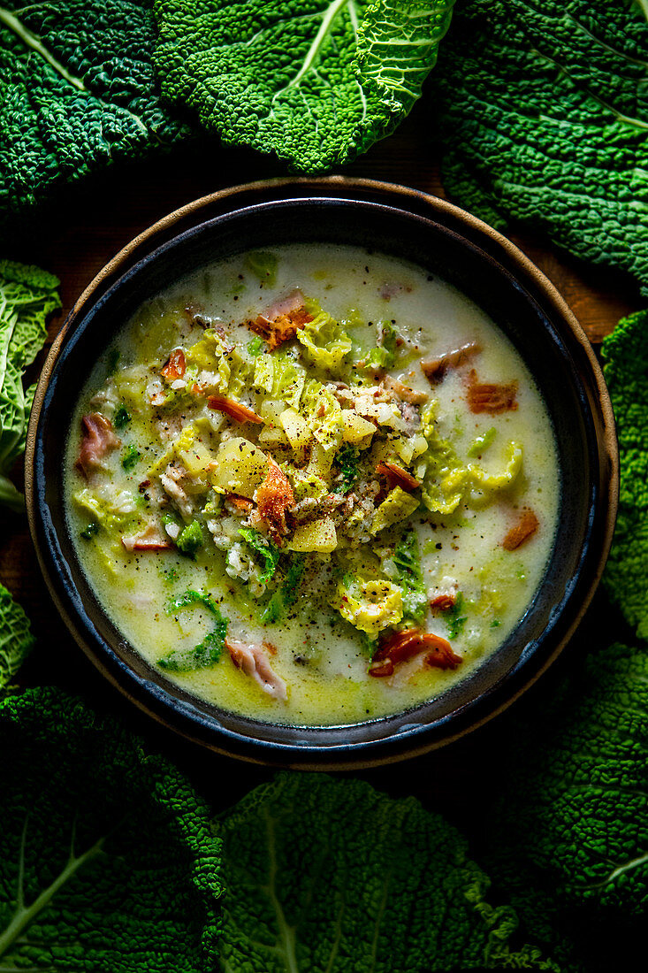 Portuguese smoked fish soup with savoy cabbage