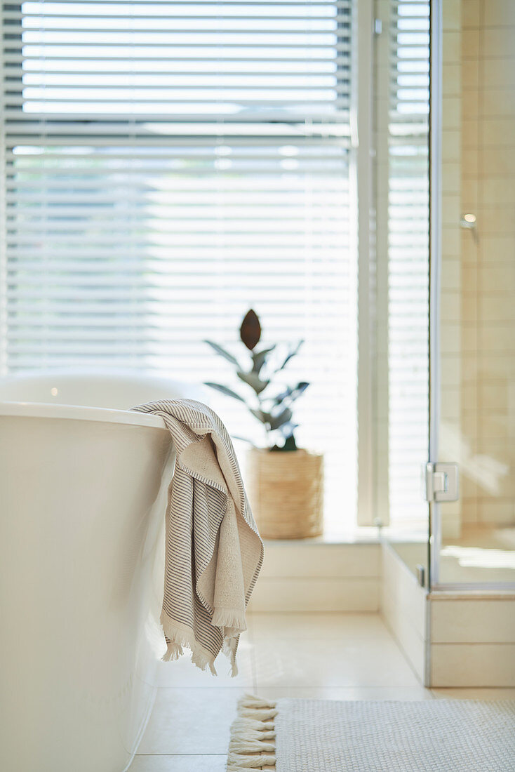 Towel hanging over soaking tub