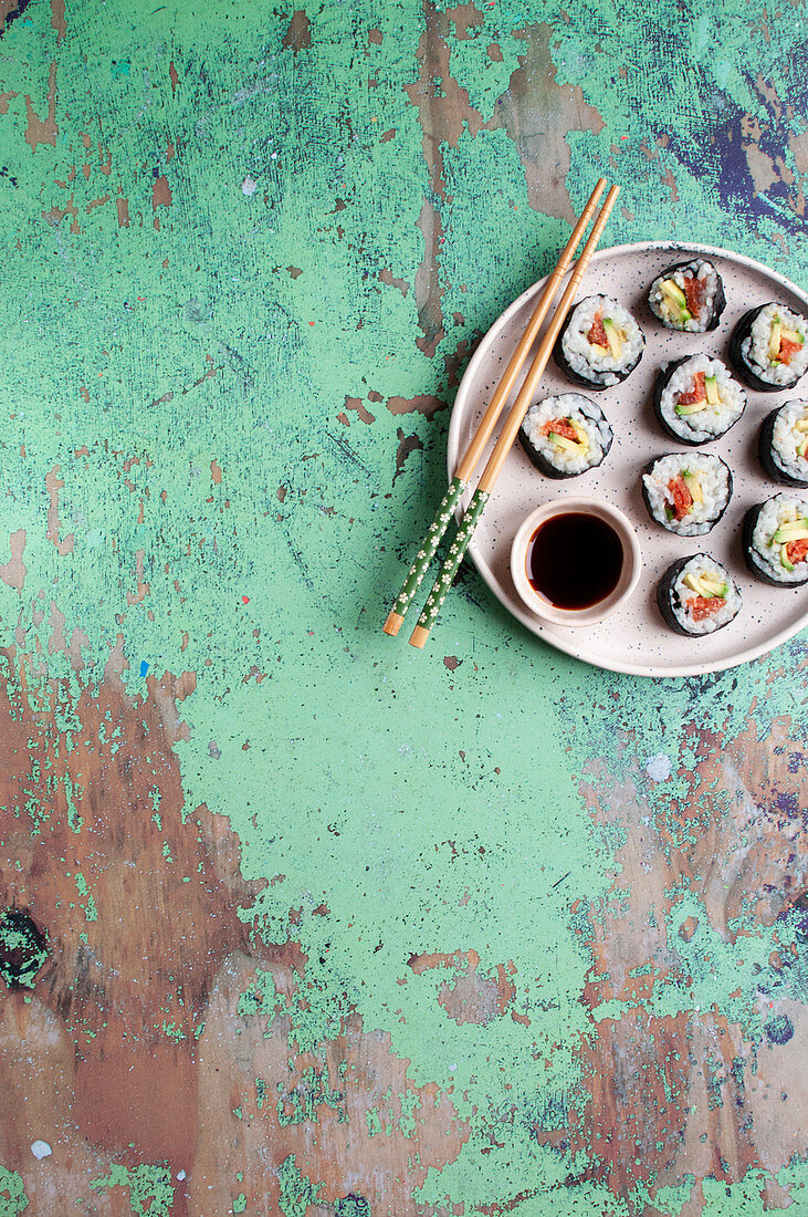 Sushi with avocado, smoked salmon and umeboshi plum