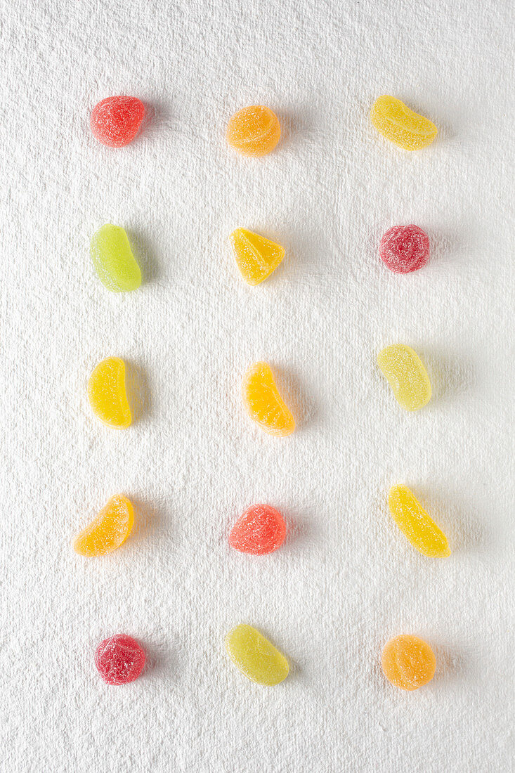 Gumdrops, lined up on a white background