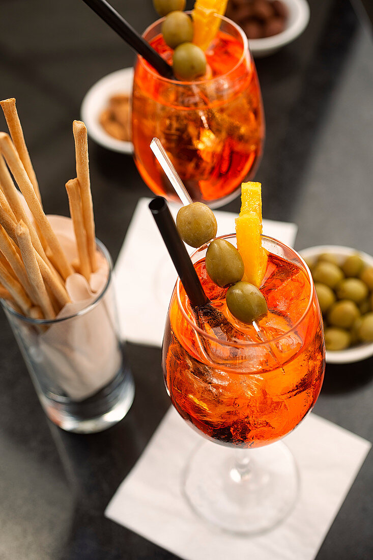 Aperitif with Aperol Spritz, olives and grissini