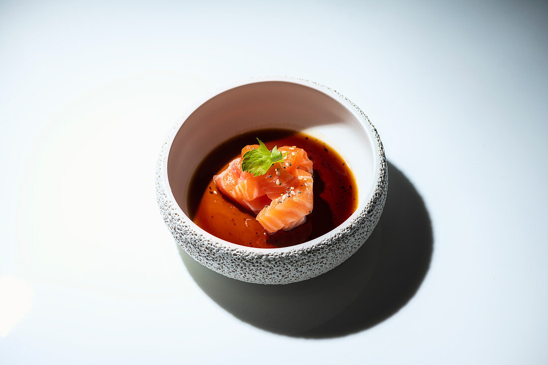 Raw salmon sashimi with soy sauce