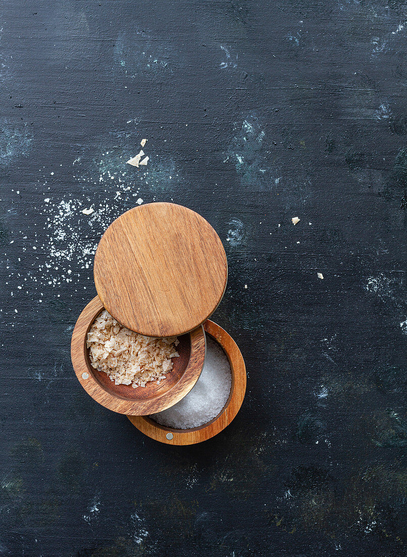 Assorted types of salt in wooden jars