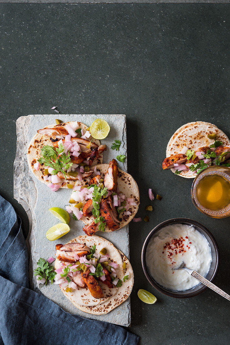 Traditional Mexican chicken tacos with jalapenos and fresh coriander