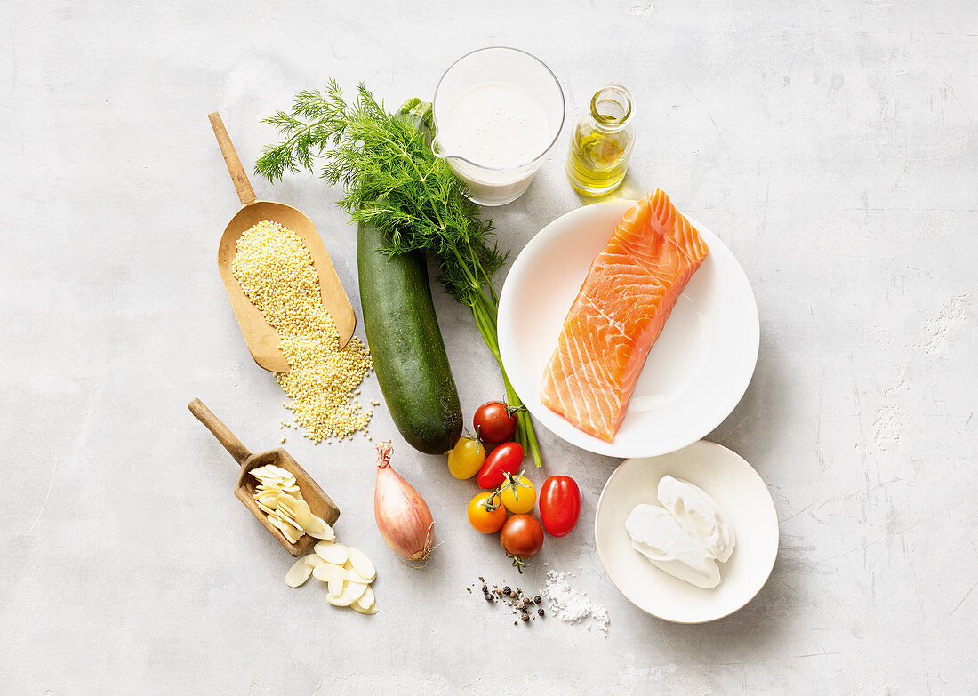 Ingredients for salmon with millet and zucchini-tomato chunks