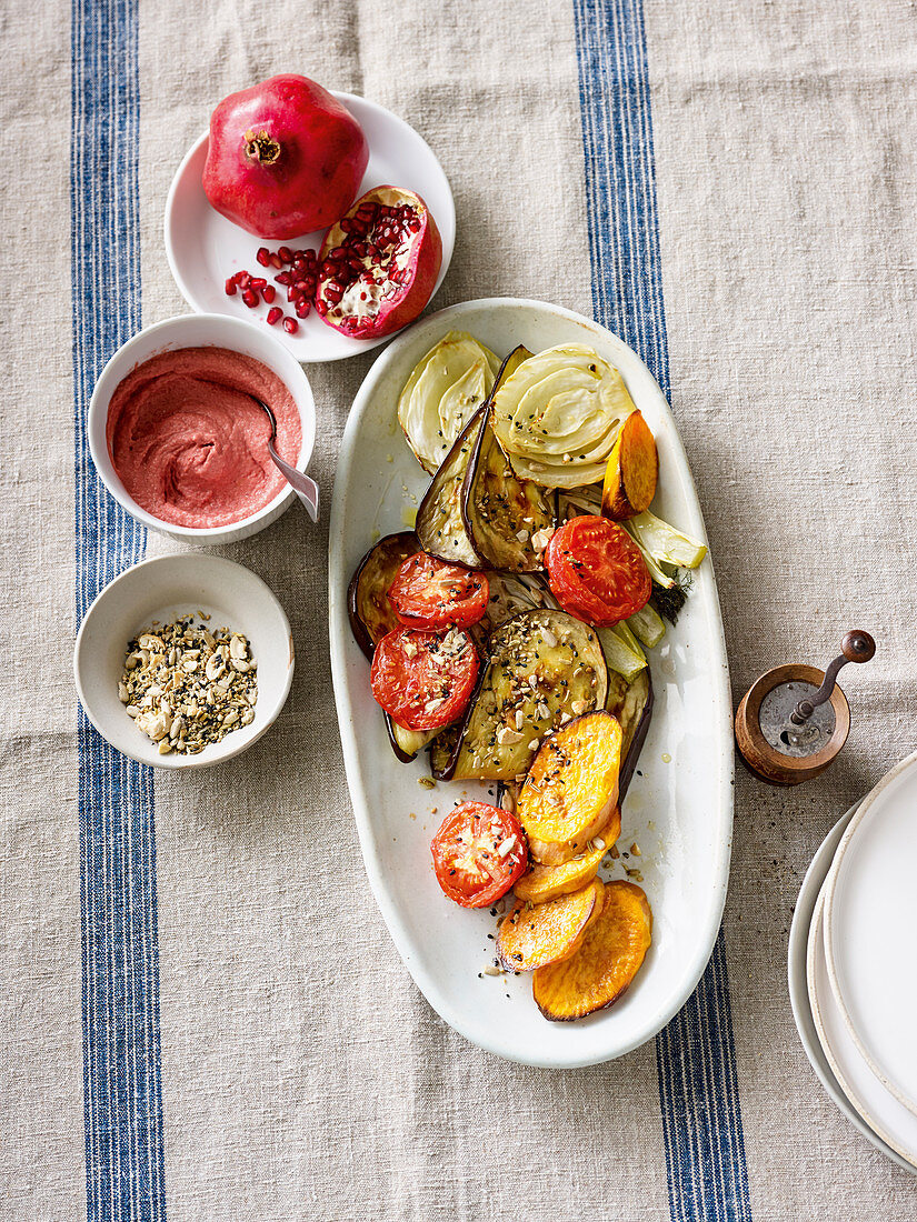 Vegan summer vegetables with beetroot hummus and dukkah