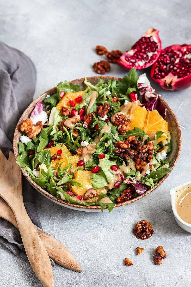 Winter salad with pomegranate, oranges and nuts (vegan)