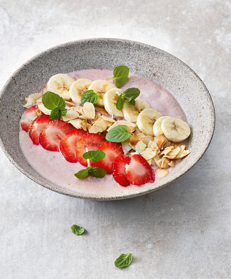 Vegan smoothie bowl with banana and strawberries