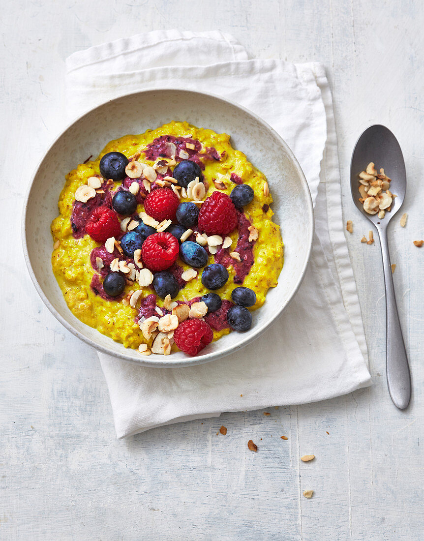 Hazelnut porridge with berries and sultanas