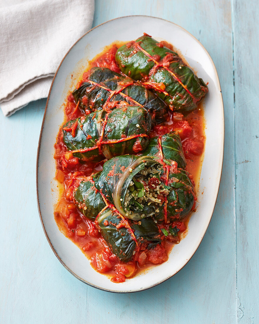 Vegan chard parcels with quinoa in tomato sauce