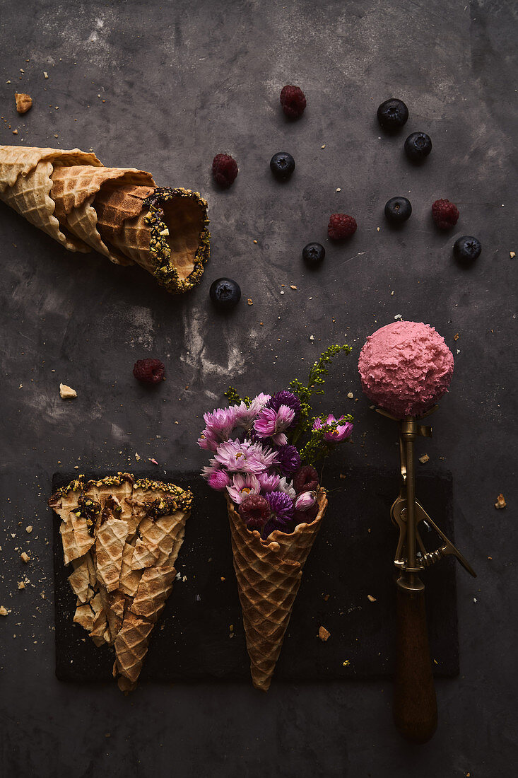 Pink ice cream scoop and waffle cone with flowers