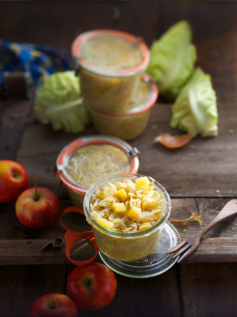 Preserved wine cabbage with apples in jars