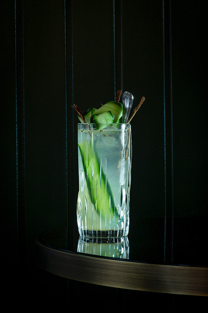 Cocktail garnished with cucumber slices
