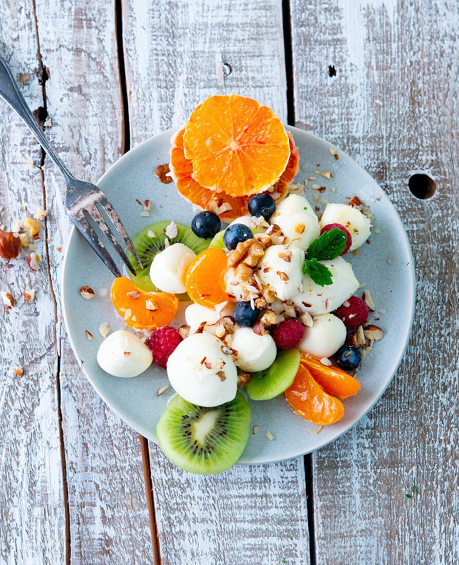 Mozzarella fruit salad with chopped nuts