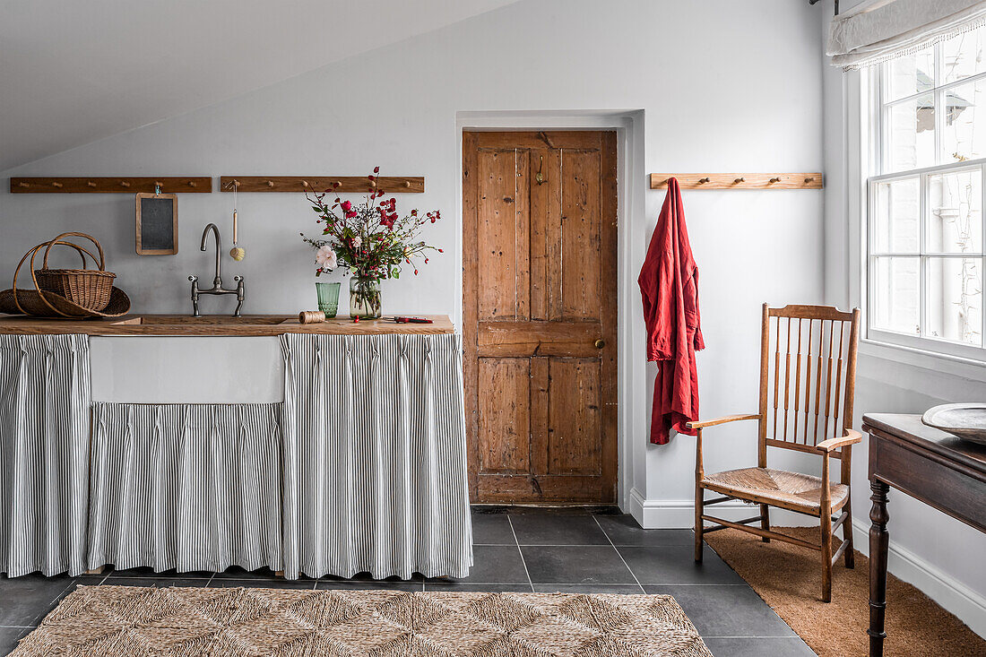 Washstand with curtain in bathroom