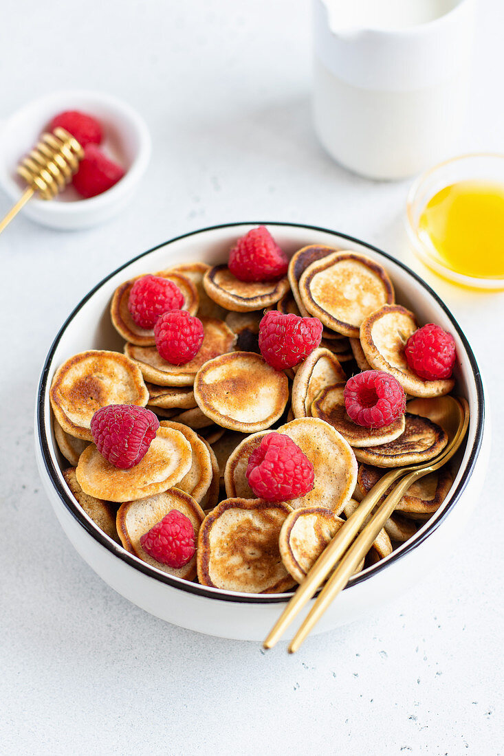 Bowl of pancake cereal with raspberries