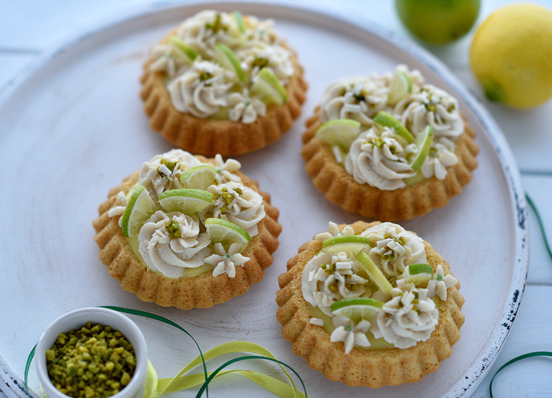 Vegan lime-lemon tartlet with a sponge cake base