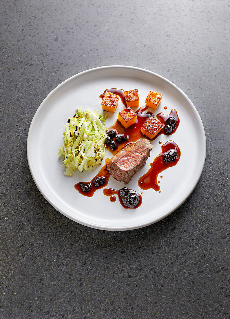 Leg of venison with turnips, white cabbage and blackcurrant sauce