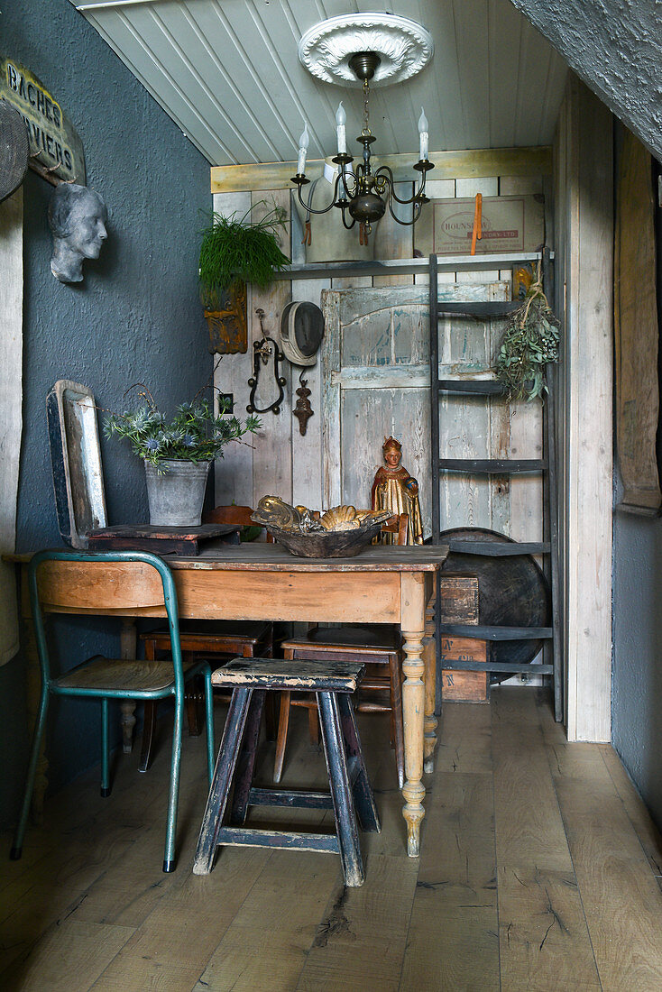 Various chairs around wooden table in vintage-style dining room